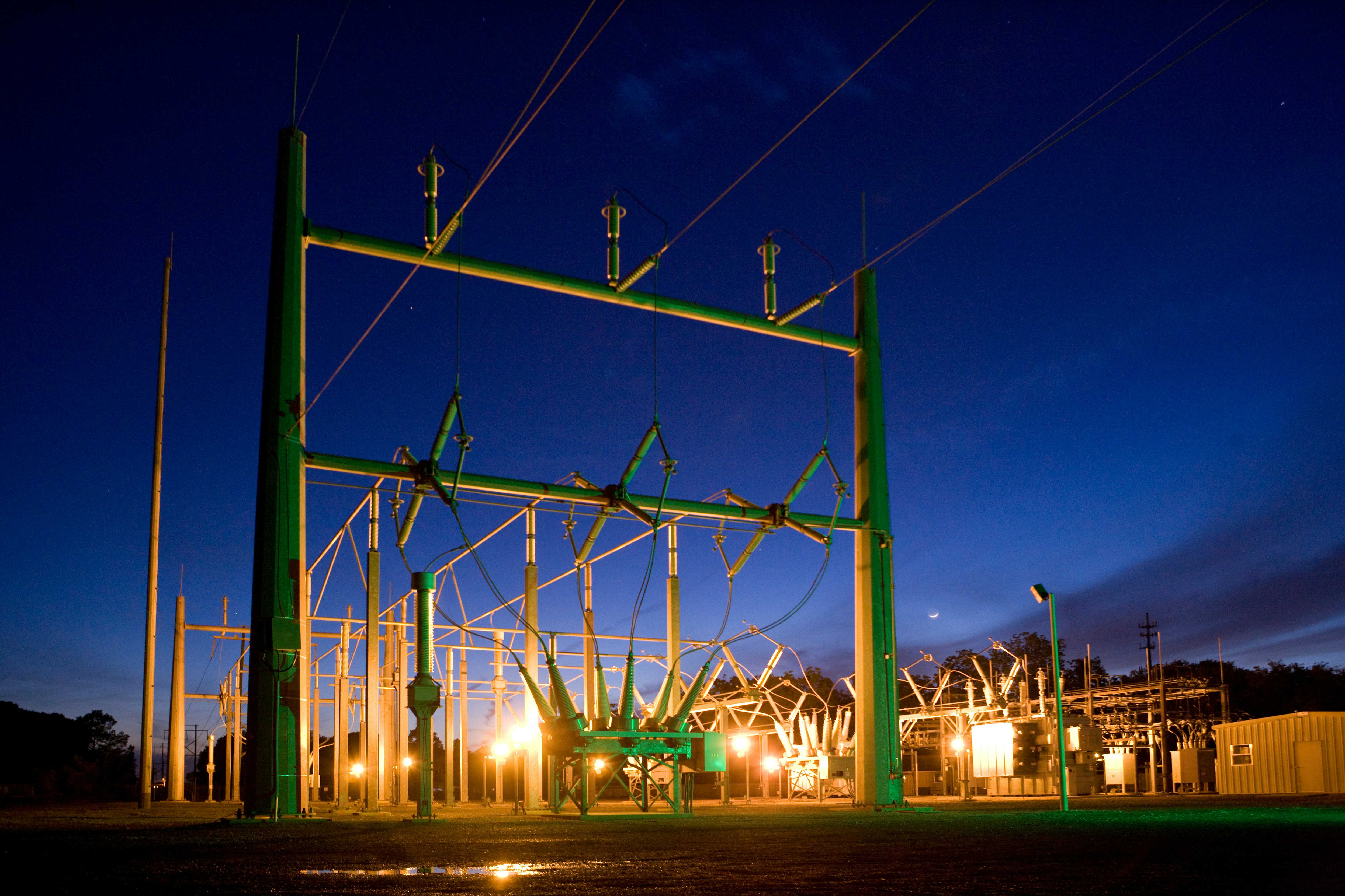 High-voltage substation infrastructure at dusk